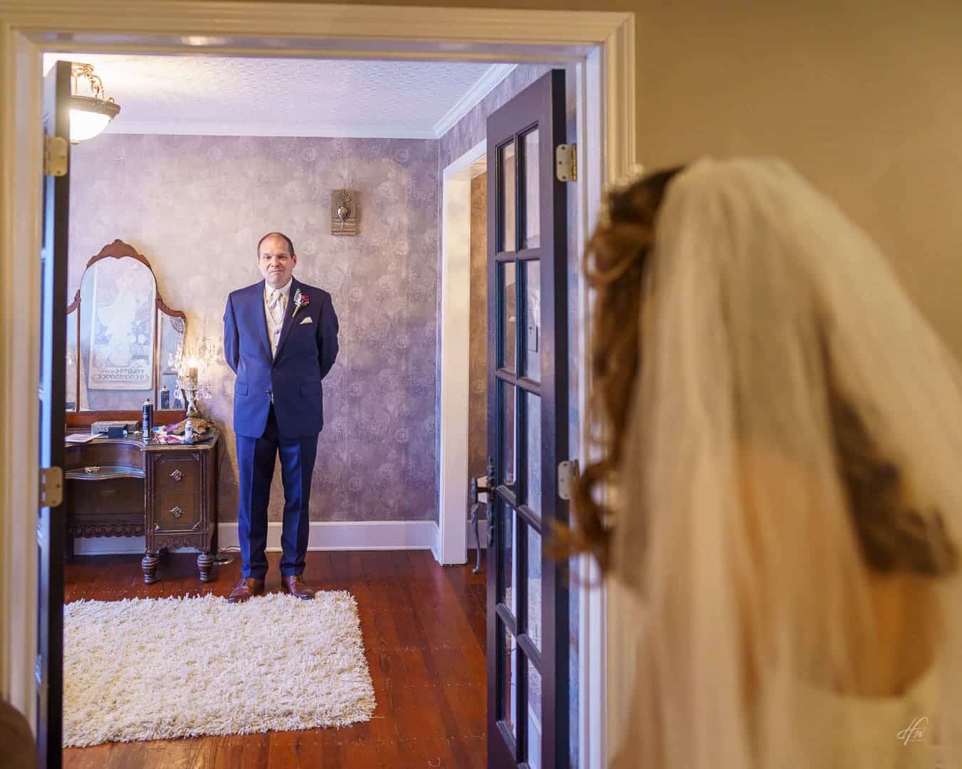 Father sees bride for first time in wedding dress.